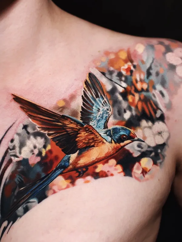 Color realism bird tattoo — swallow with cherry blossoms