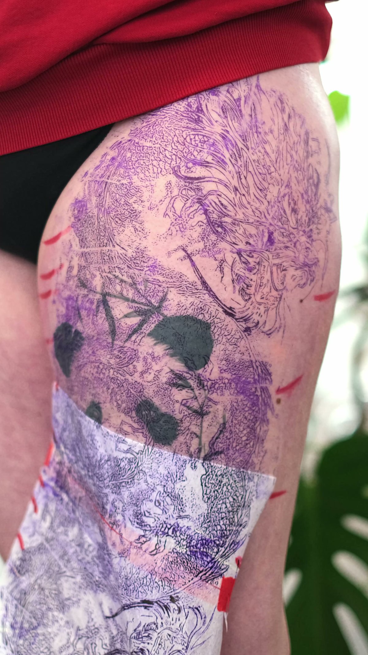 Color realism cover-up by Alex666cold — a black-and-grey panda reworked into a colorful dragon in churning water, full thigh